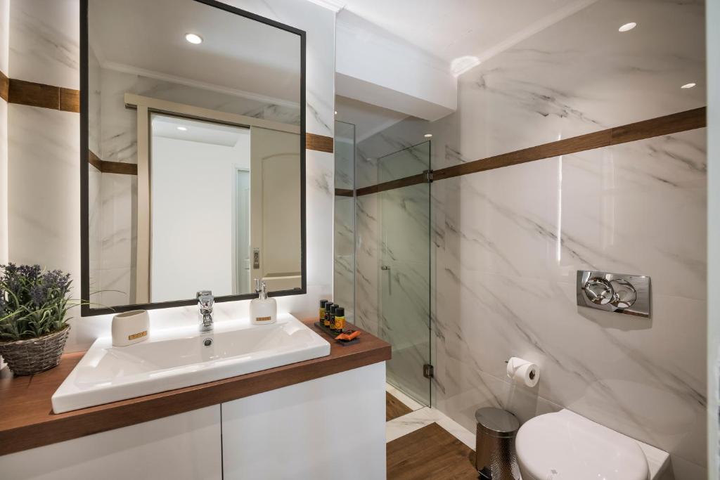 Kúpeľňa v ubytovaní Sun Ray Luxury Apartments