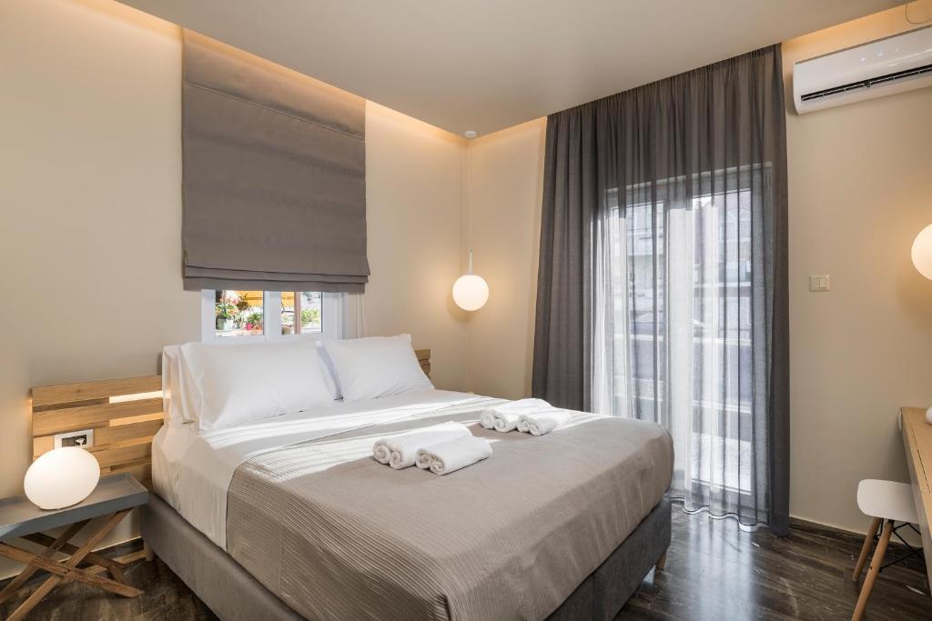 Posteľ alebo postele v izbe v ubytovaní Sun Ray Luxury Apartments