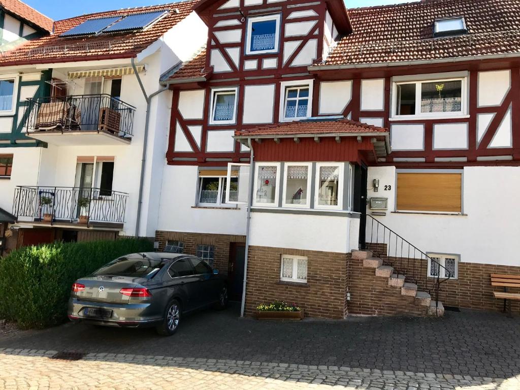 a car parked in front of a house at Monteur &,Geschäftsreisen Stay in Günsterode