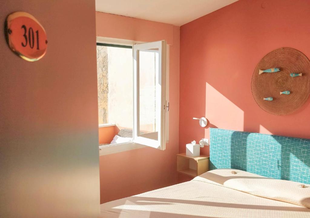 Postel nebo postele na pokoji v ubytování Ai Pesci Room Rental