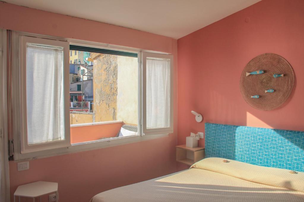 Postel nebo postele na pokoji v ubytování Ai Pesci Room Rental