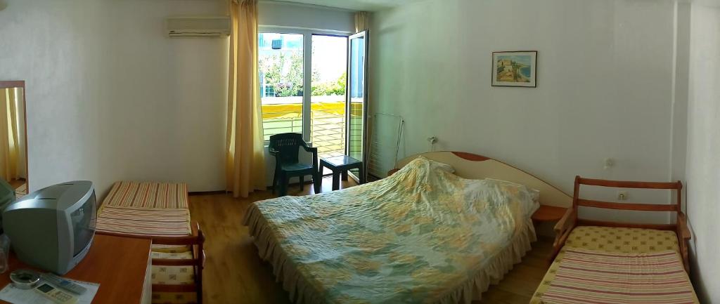 Postel nebo postele na pokoji v ubytování Harmony Beach Family Hotel