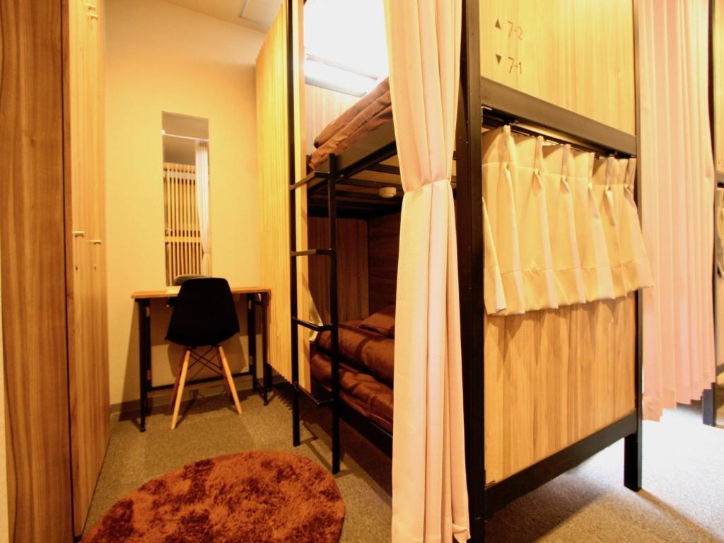 Postel nebo postele na pokoji v ubytování Namba Guesthouse HIVE