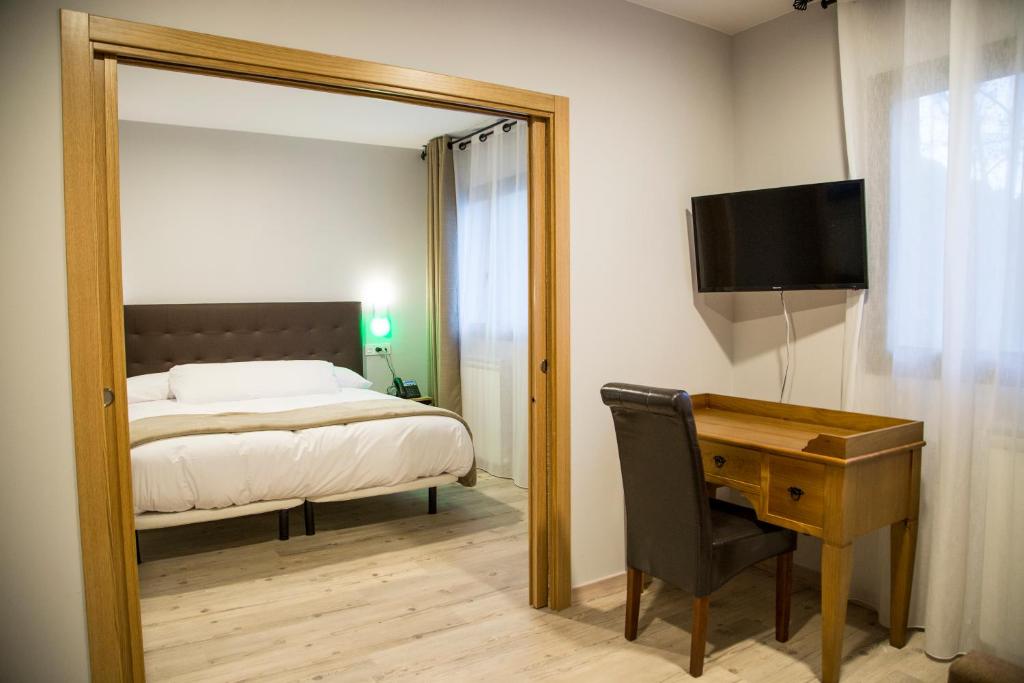 Postel nebo postele na pokoji v ubytování El Capricho de Arguis
