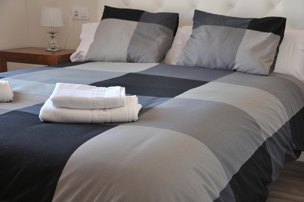 Postel nebo postele na pokoji v ubytování Apartamentos Sábora