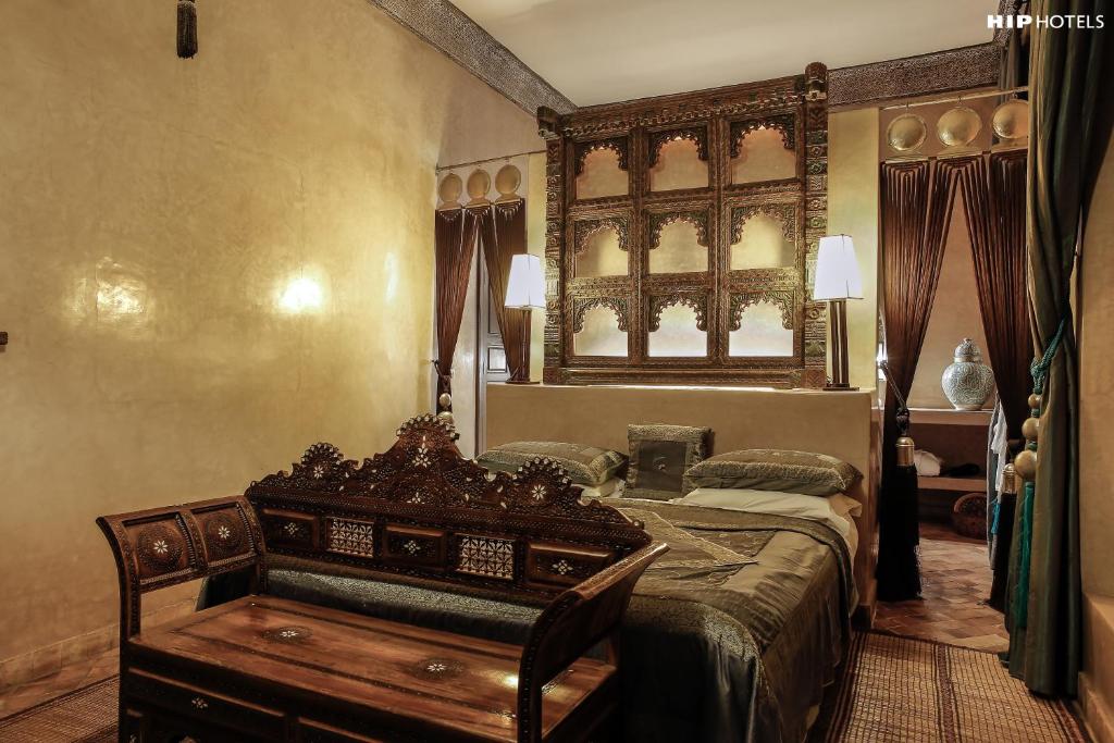 Postel nebo postele na pokoji v ubytování Riad Noir d'Ivoire