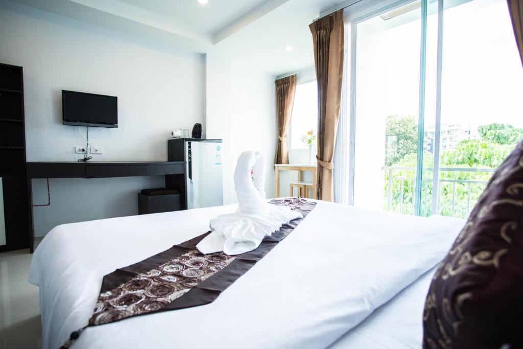 Postel nebo postele na pokoji v ubytování Happy 99 Guest house