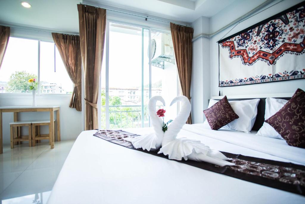 Postel nebo postele na pokoji v ubytování Happy 99 Guest house