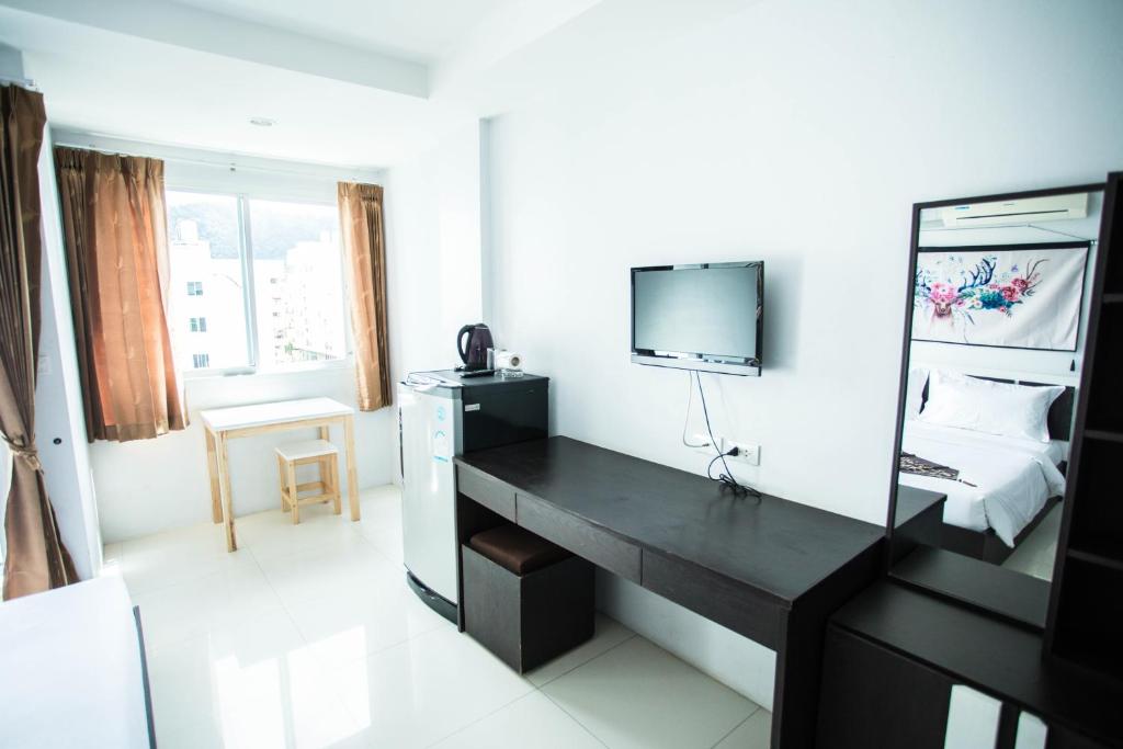 TV a/nebo společenská místnost v ubytování Happy 99 Guest house