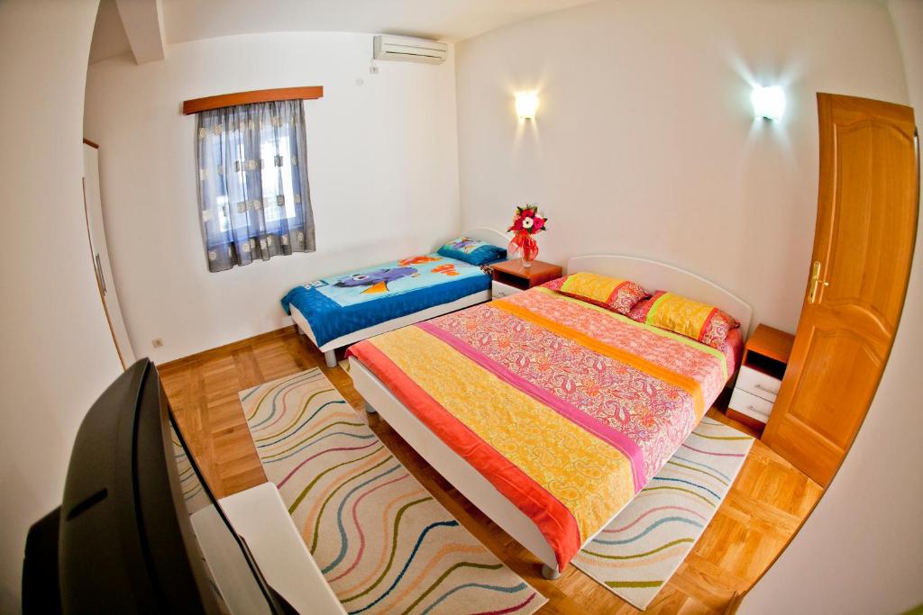 Postel nebo postele na pokoji v ubytování Apartments Stefan