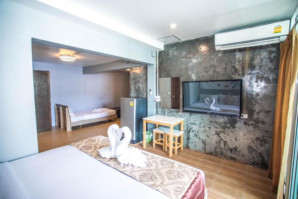Postel nebo postele na pokoji v ubytování Happy 99 Guest house