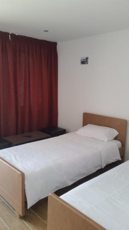 Postel nebo postele na pokoji v ubytování Banya Guest Rooms 23