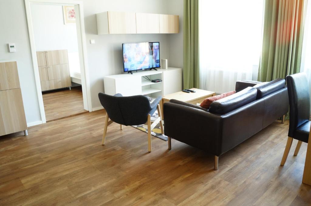 TV a/nebo společenská místnost v ubytování Apartmány Mary