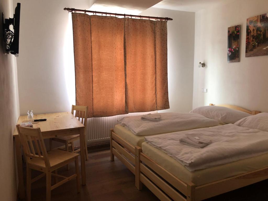 Postel nebo postele na pokoji v ubytování Penzion Hvězda - Restaurace dočasně uzavřena
