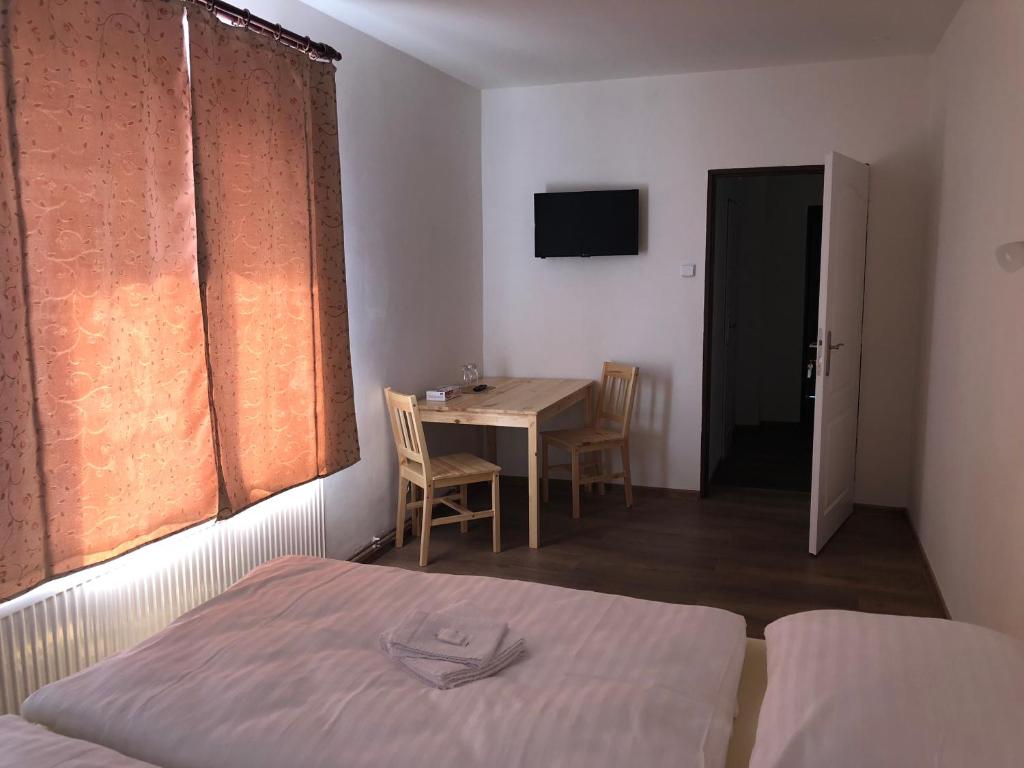 Postel nebo postele na pokoji v ubytování Penzion Hvězda - Restaurace dočasně uzavřena