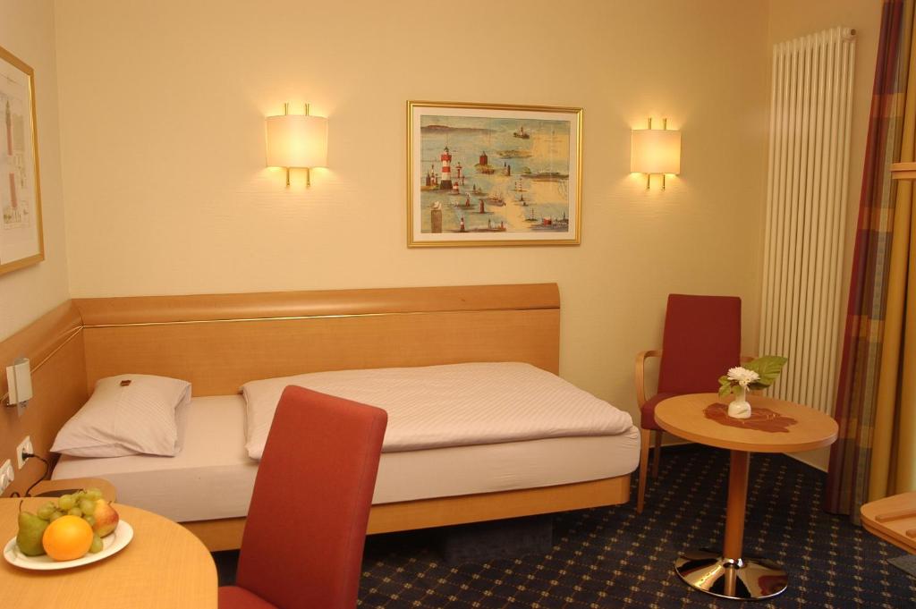 Postel nebo postele na pokoji v ubytování Hotel Prinz Heinrich