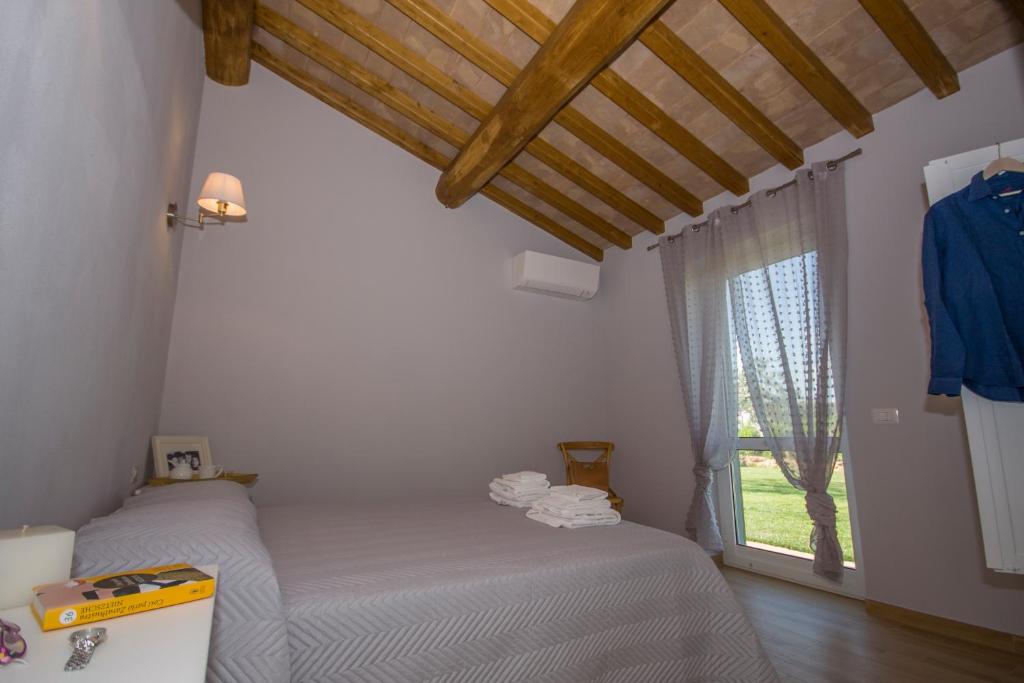 Posteľ alebo postele v izbe v ubytovaní Agriturismo Il Mirto