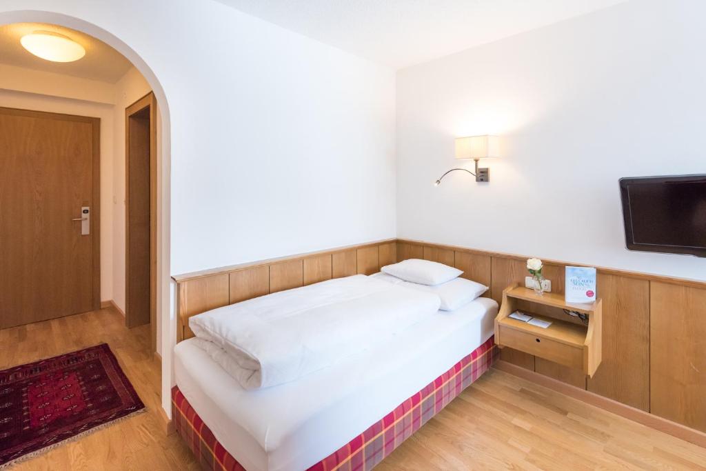 Postel nebo postele na pokoji v ubytování Hotel Walserberg