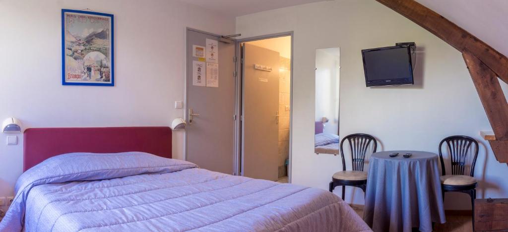 Postel nebo postele na pokoji v ubytování Hôtel De Paris