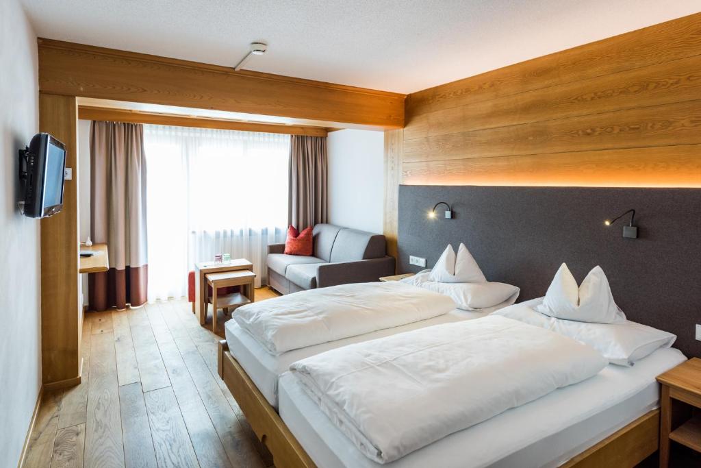 Postel nebo postele na pokoji v ubytování Hotel Walserberg