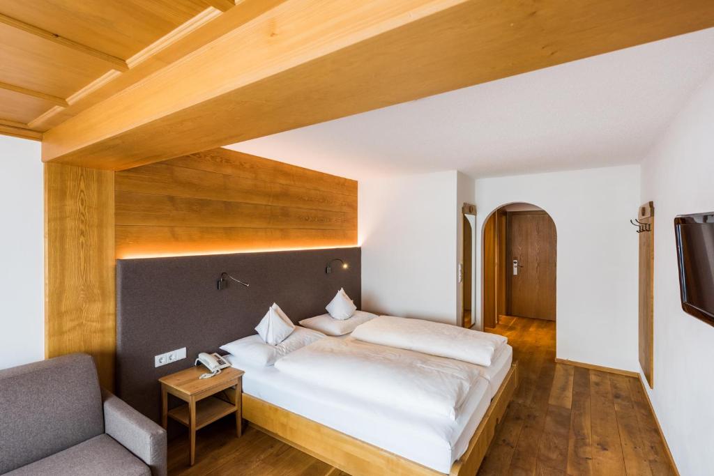 Postel nebo postele na pokoji v ubytování Hotel Walserberg