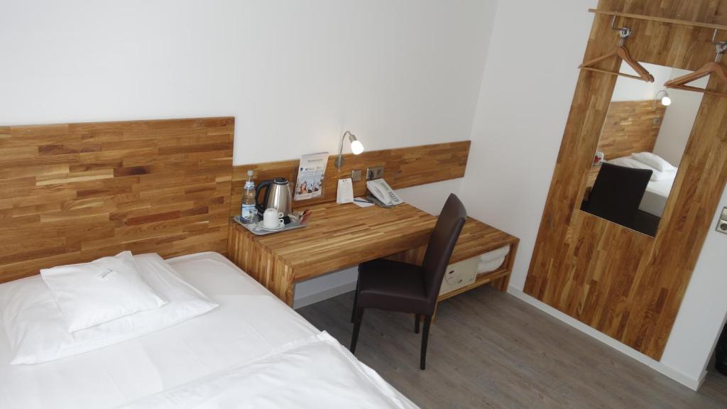 Postel nebo postele na pokoji v ubytování Hotel Stuttgart 21