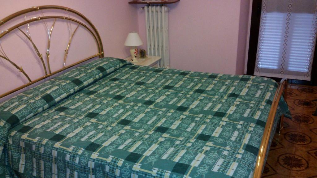 Postel nebo postele na pokoji v ubytování B&B I Lazzarini