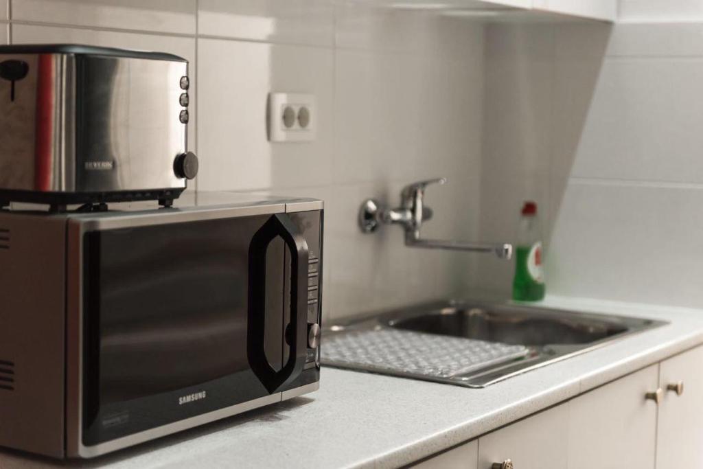 Kuchyň nebo kuchyňský kout v ubytování Kumba Hostel
