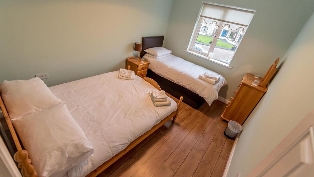 Giường trong phòng chung tại An Sean Ostan Apartments