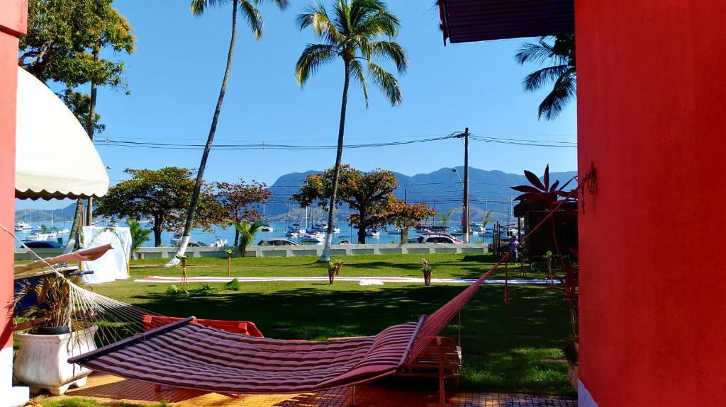  ALOHA em frente a praia- Suítes privativas & hostel