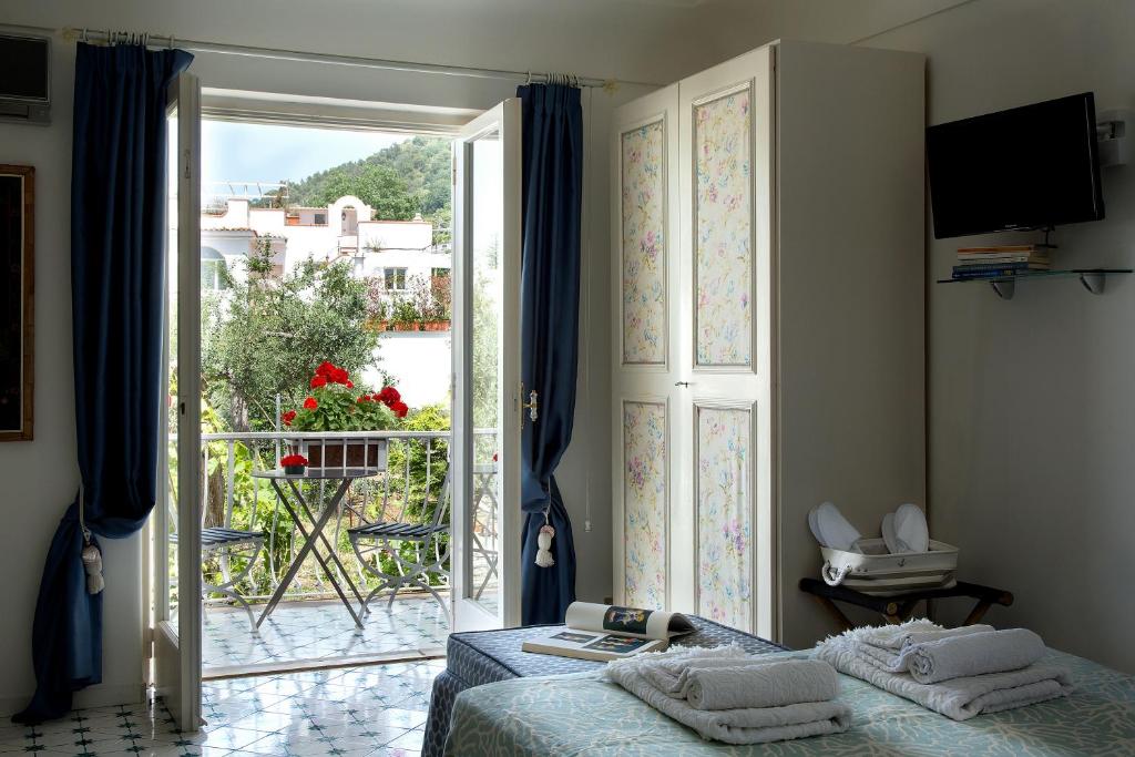 Postel nebo postele na pokoji v ubytování Riolinciano14 B&B