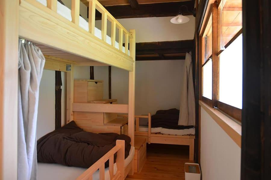 Postel nebo postele na pokoji v ubytování Guesthouse Soranoie
