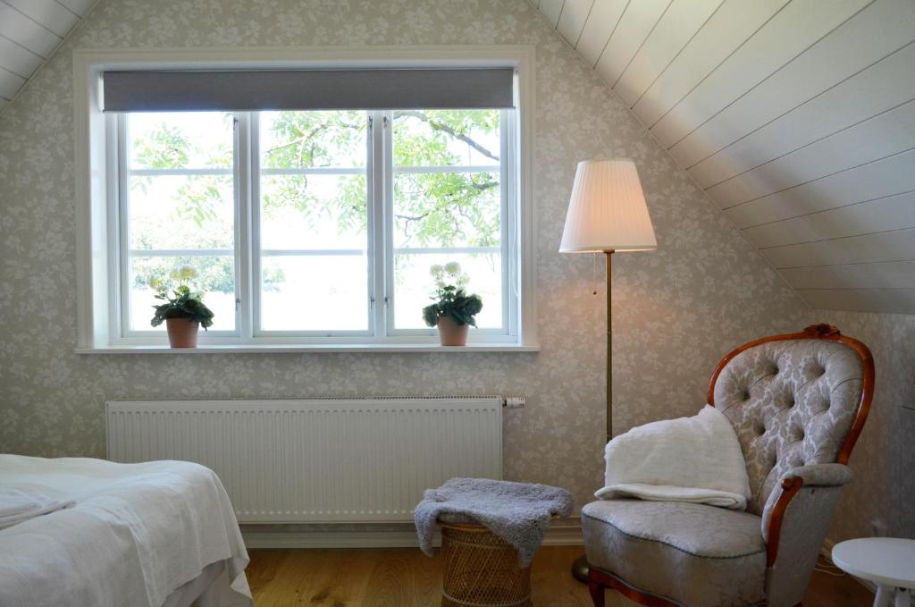 Postel nebo postele na pokoji v ubytování Torsborgs Gård