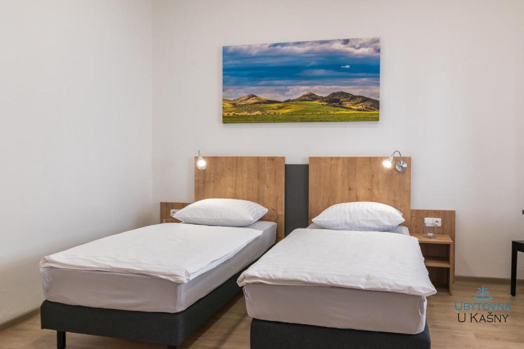 Postel nebo postele na pokoji v ubytování Ubytovna U Kašny