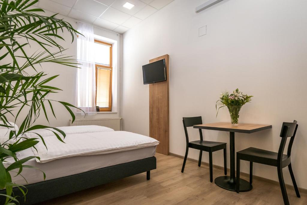 Postel nebo postele na pokoji v ubytování Ubytovna U Kašny