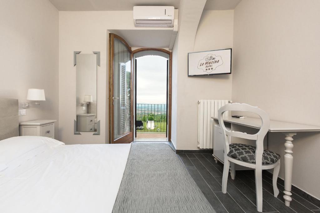 Postel nebo postele na pokoji v ubytování Hotel Le Macine