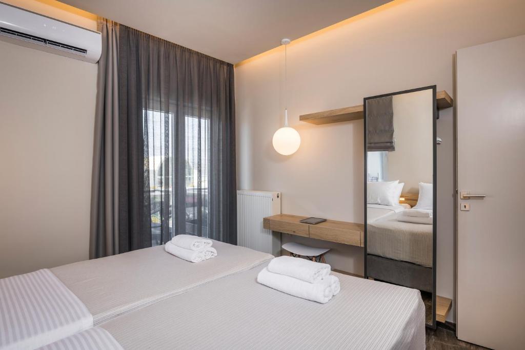 Posteľ alebo postele v izbe v ubytovaní Sun Ray Luxury Apartments