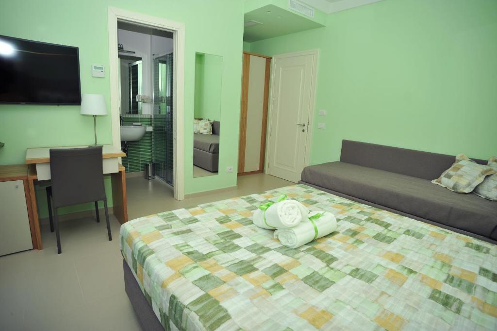 Postel nebo postele na pokoji v ubytování Villa Paradise Resort
