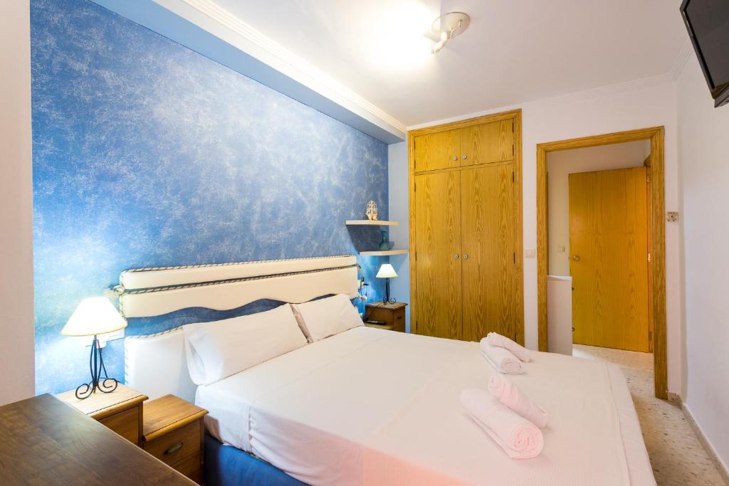 Кровать или кровати в номере ApartUP Saplaya Harbour