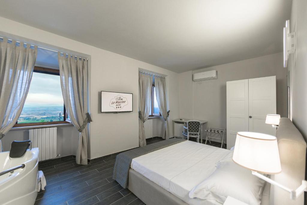 Postel nebo postele na pokoji v ubytování Hotel Le Macine