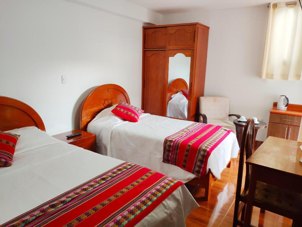 Postel nebo postele na pokoji v ubytování Casa Kuelap Hostal