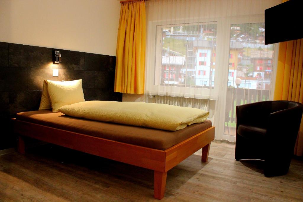 Postel nebo postele na pokoji v ubytování Hotel Alpha