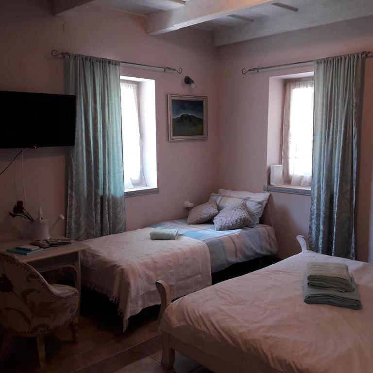 Posteľ alebo postele v izbe v ubytovaní Bástya apartman