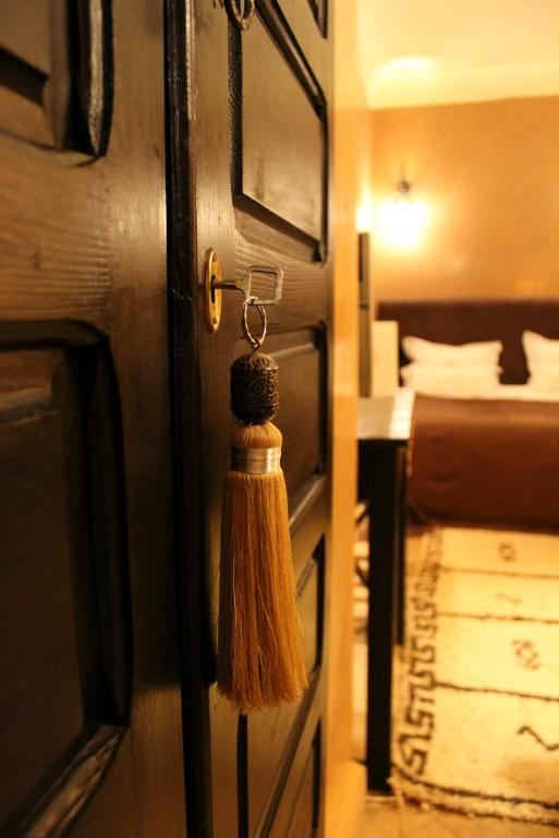 Postel nebo postele na pokoji v ubytování Riad Hermès