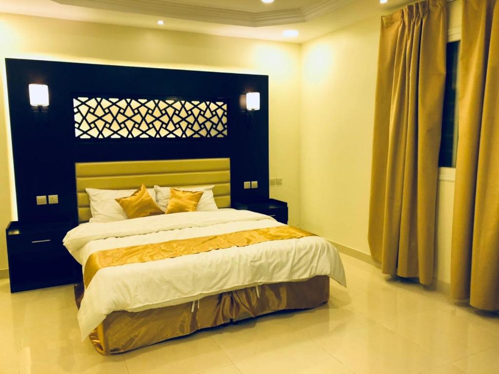 Postel nebo postele na pokoji v ubytování وشل للشقق المخدومة واحة الغروب سابقا Washal Serviced Apartments