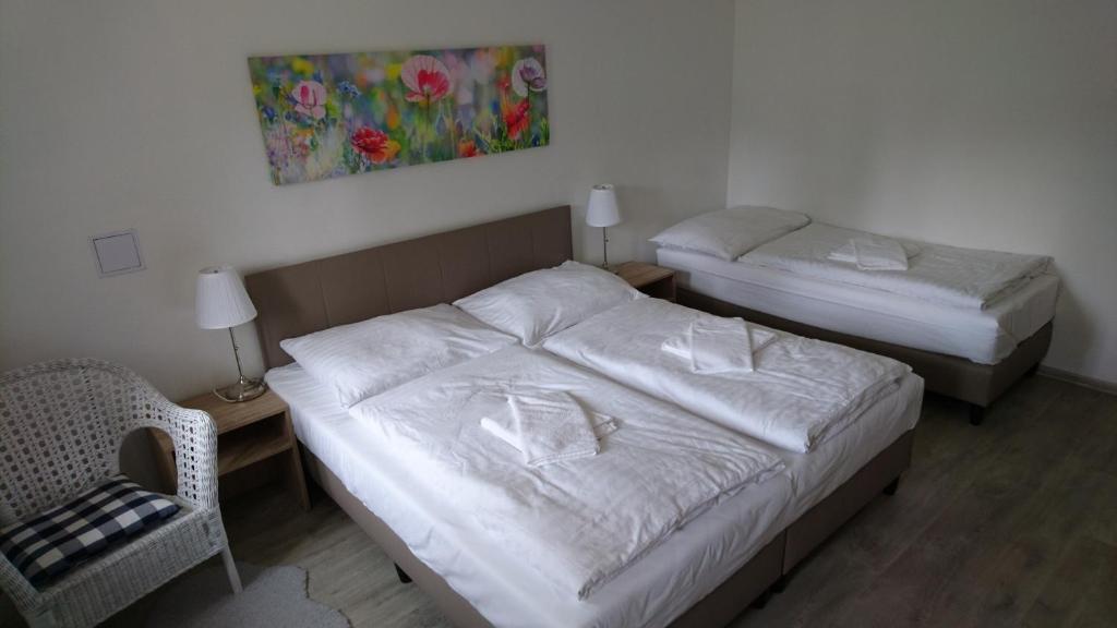 Łóżko lub łóżka w pokoju w obiekcie Apartmány Nova Lake