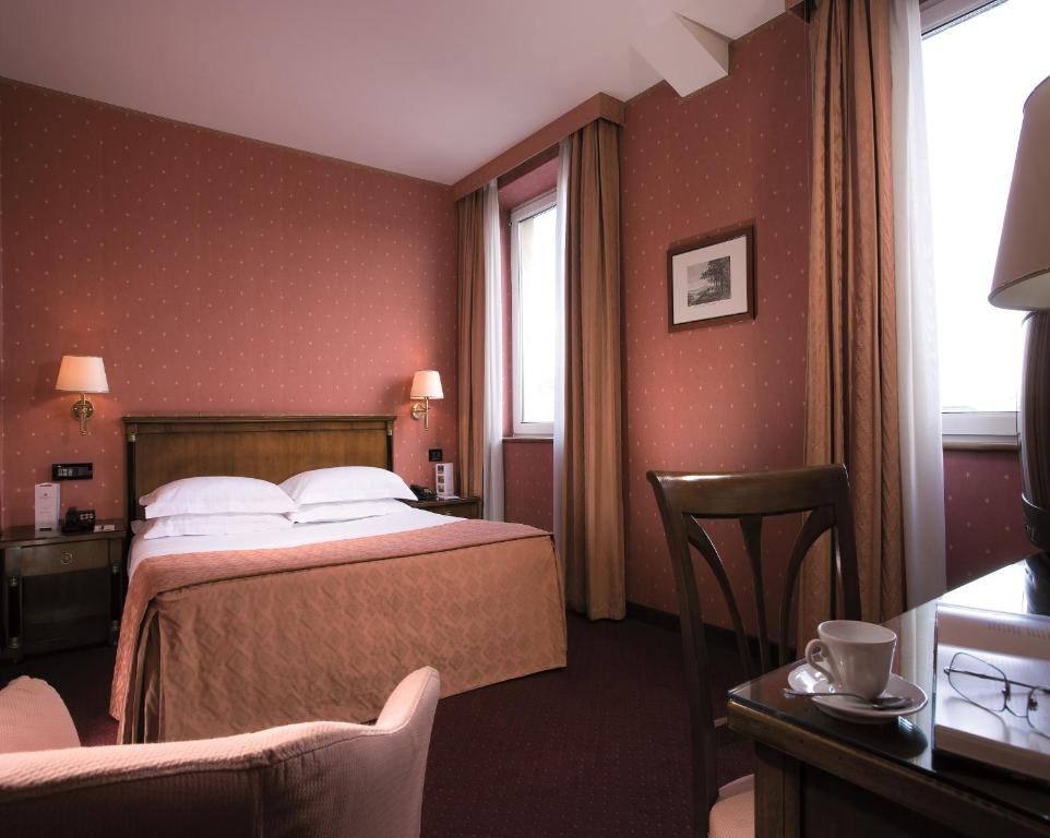 Łóżko lub łóżka w pokoju w obiekcie Ramada by Wyndham Naples