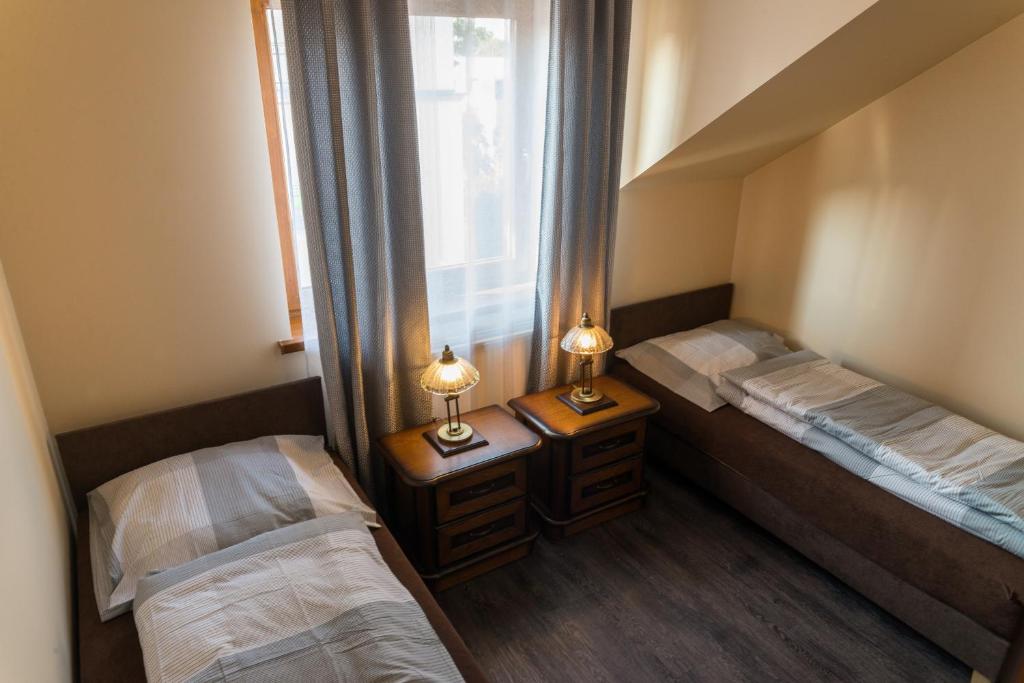 Posteľ alebo postele v izbe v ubytovaní Apartamenty Koba