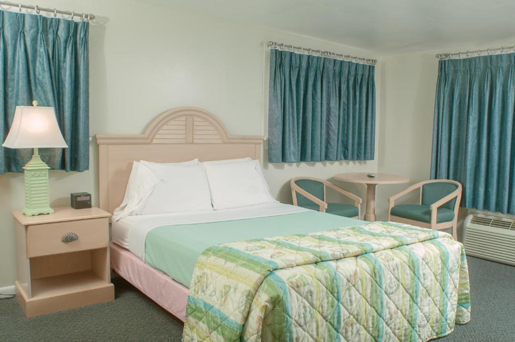 Postel nebo postele na pokoji v ubytování Southfleet Motor Inn