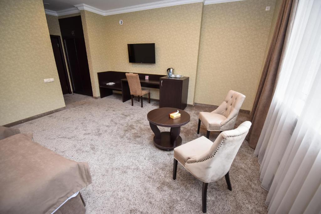TV a/nebo společenská místnost v ubytování Laguna Hotel